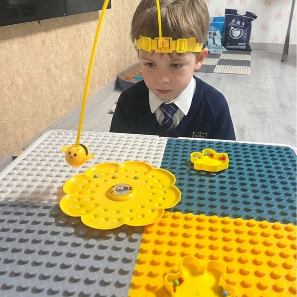 Child using Magnetic 2-player Bee Headband Game