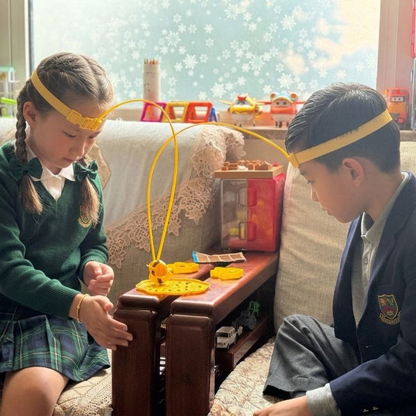 Child using Magnetic 2-player Bee Headband Game