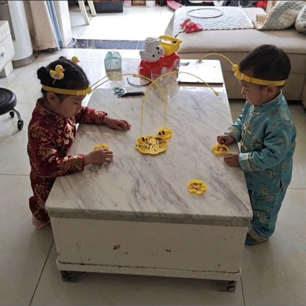 Child using Magnetic 2-player Bee Headband Game