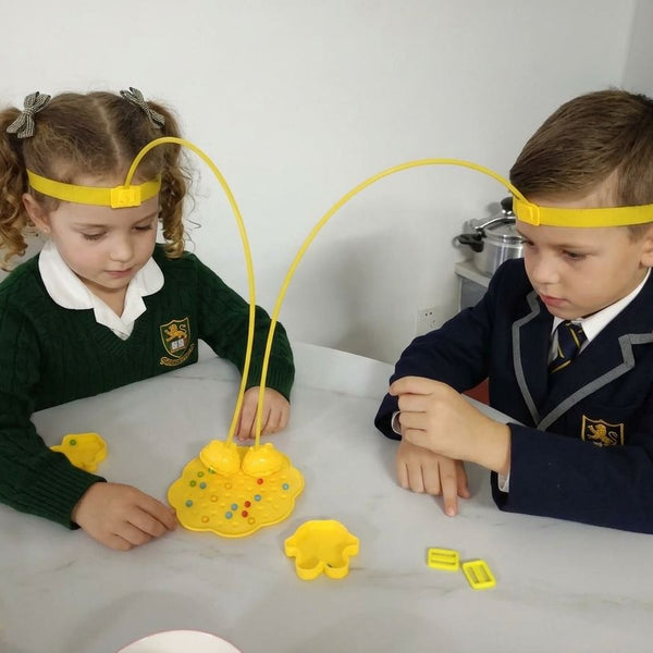 Child using Magnetic 2-player Bee Headband Game