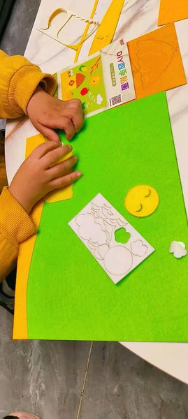 Child using DIY 4‑Season Felt Fabric Art Craft Kit