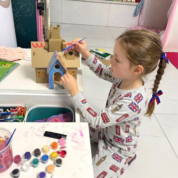 Child using 2pcs DIY Cardboard House Building & Painting Kit: Build, Paint & Play