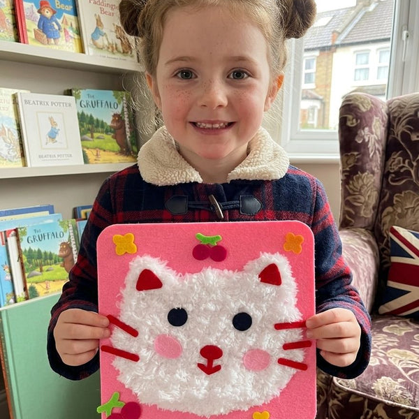 Child using DIY Fluffy Animal Art Kit — Pompom Yarn Craft for Kids