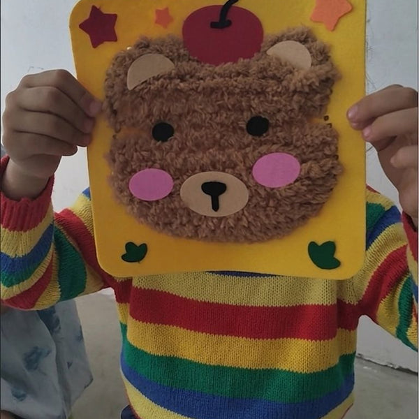 Child using DIY Fluffy Animal Art Kit — Pompom Yarn Craft for Kids