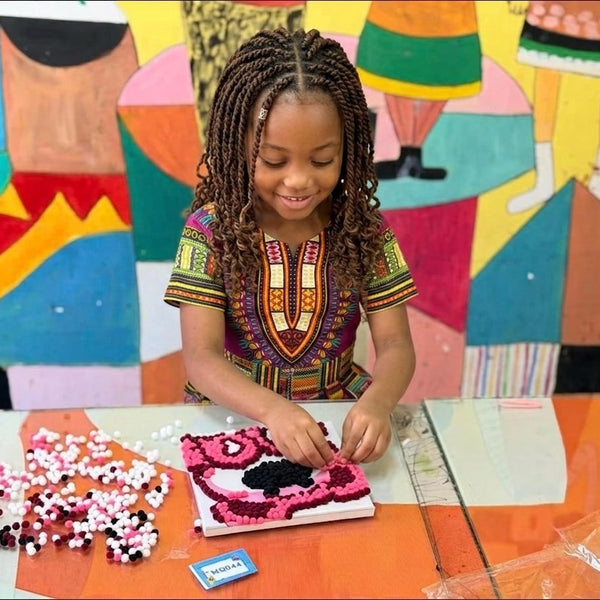 Child using Pompom painting