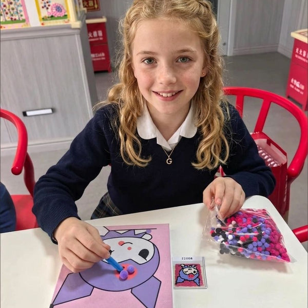 Child using Pompom painting
