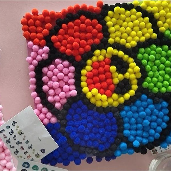 Child using Pompom Craft