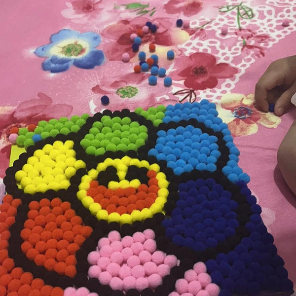 Child using Pompom Craft