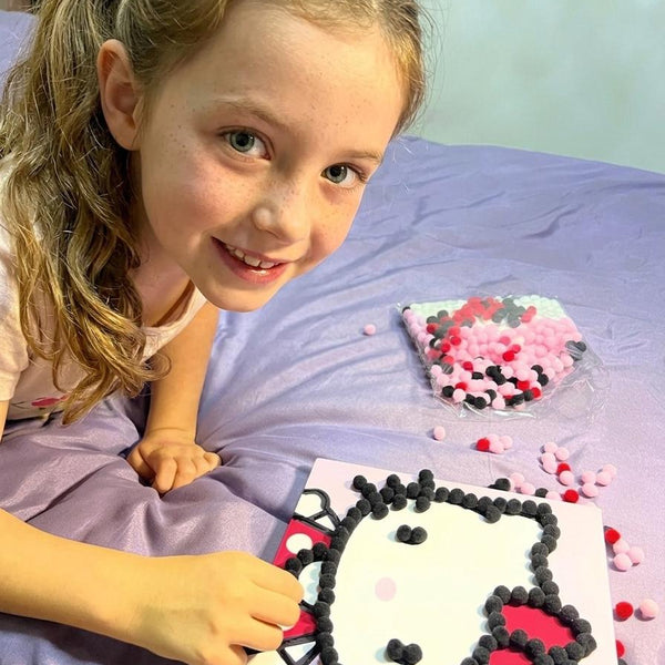 Child using Pompom Craft