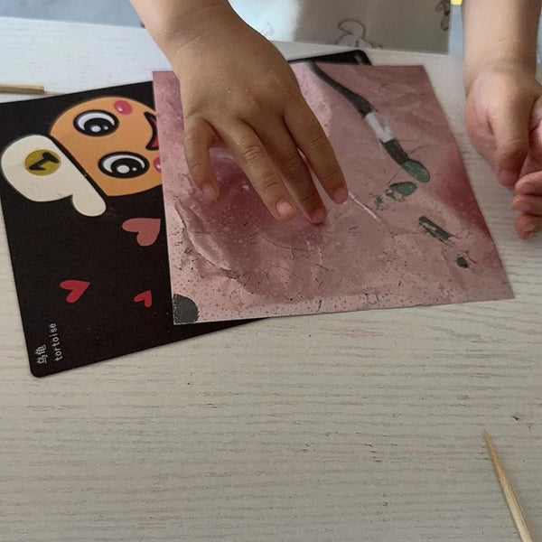 Child using Magic Art Transfer Painting