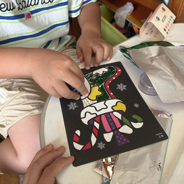 Child using Magic Art Transfer Painting