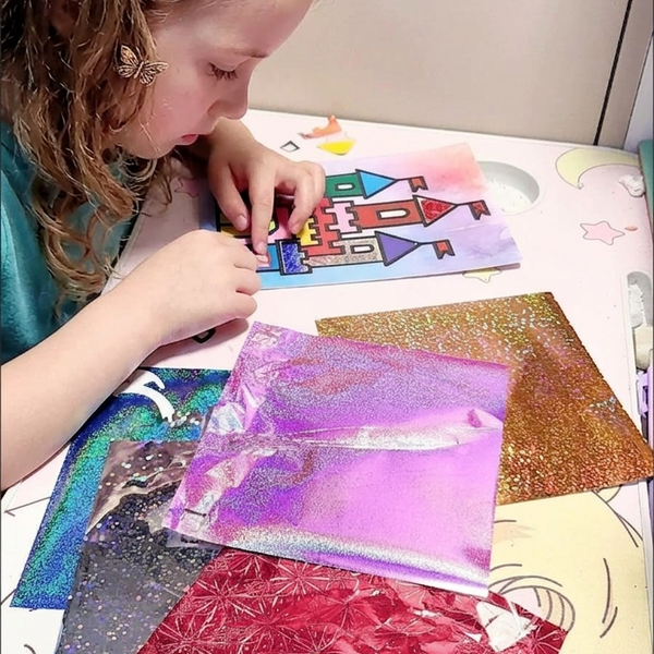 Child using Magic Art Transfer Painting